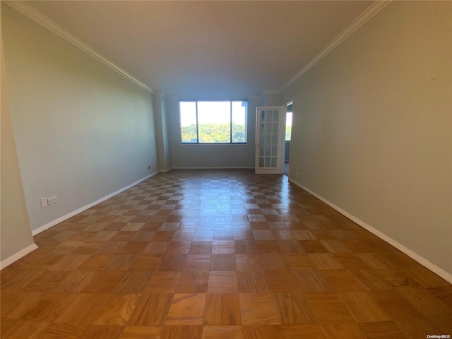 unfurnished room featuring crown molding and parquet floors