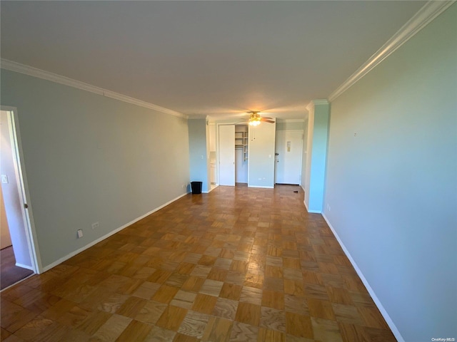 spare room with parquet flooring and crown molding