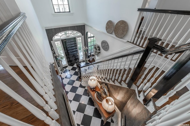 staircase featuring a high ceiling