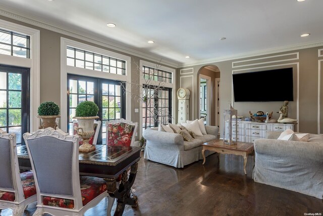 1974 Monroe Ave, North Bellmore, NY 11710 - living area with arched walkways, wood finished floors, ornamental molding, healthy amount of natural light, and recessed lighting