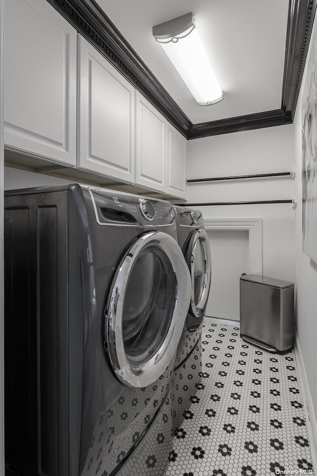 1974 Monroe Ave, North Bellmore, NY 11710 - laundry room with separate washer and dryer, cabinet space, light tile patterned floors, baseboards, and ornamental molding