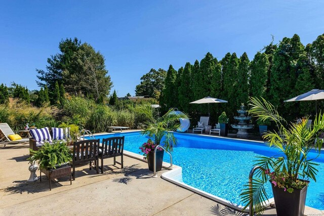 1974 Monroe Ave, North Bellmore, NY 11710 - outdoor pool featuring a patio area