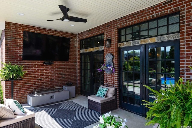 view of patio featuring french doors and ceiling fan