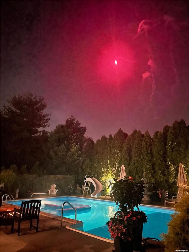 1974 Monroe Ave, North Bellmore, NY 11710 - outdoor pool featuring a water slide and a patio area