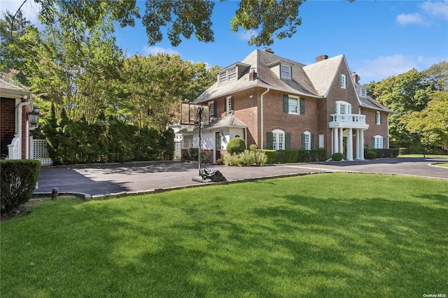 exterior space featuring a lawn and a garage