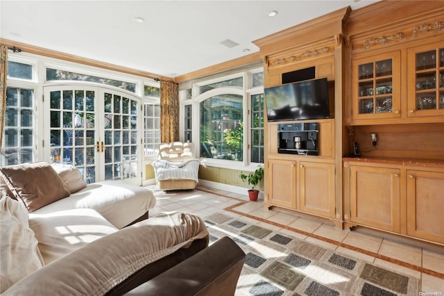 sunroom / solarium with french doors and a healthy amount of sunlight