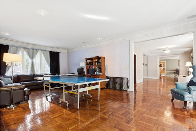 recreation room featuring parquet flooring and ornamental molding