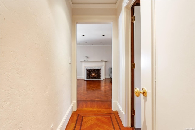 corridor featuring parquet flooring and ornamental molding