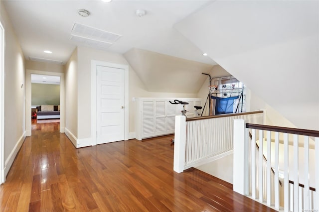 bonus room featuring hardwood / wood-style floors and vaulted ceiling