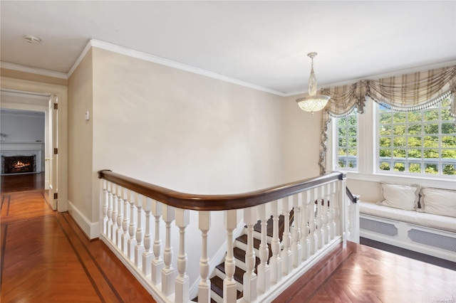 hall with ornamental molding and parquet flooring