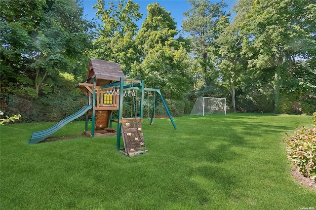 view of jungle gym featuring a lawn