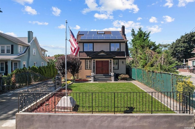 view of front facade with solar panels and a front lawn