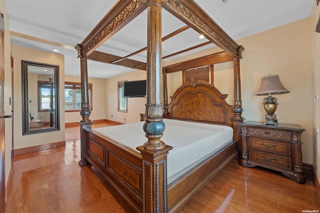 bedroom with hardwood / wood-style floors