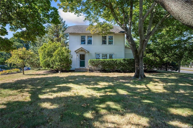 colonial inspired home with a front yard