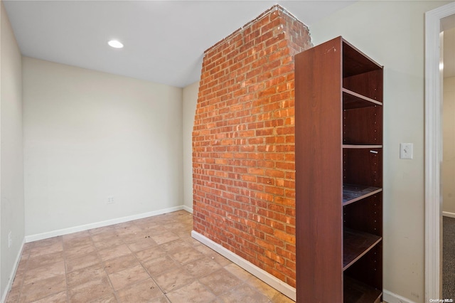 empty room with brick wall