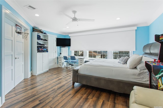 bedroom with ceiling fan and dark wood-type flooring