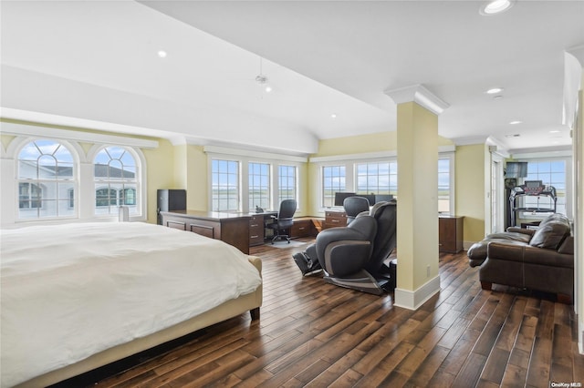 bedroom featuring dark hardwood / wood-style flooring, ornamental molding, and vaulted ceiling