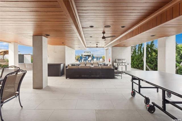 view of patio / terrace featuring an outdoor living space, ceiling fan, and a grill