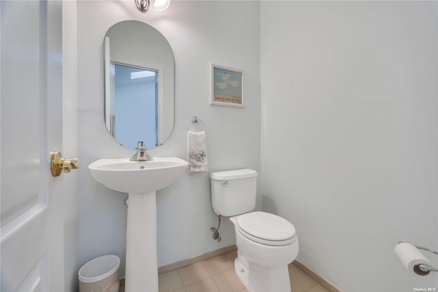 bathroom featuring tile patterned floors and toilet