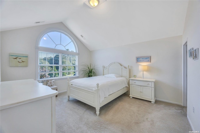 carpeted bedroom featuring vaulted ceiling