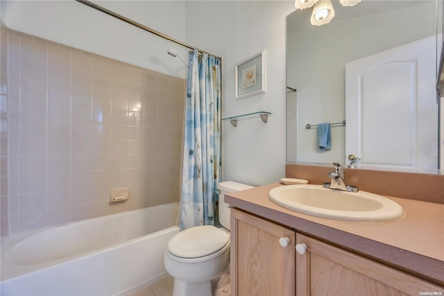 full bathroom featuring tile patterned flooring, vanity, toilet, and shower / bath combo with shower curtain