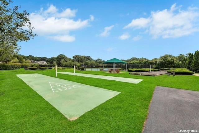 surrounding community with a gazebo and a yard