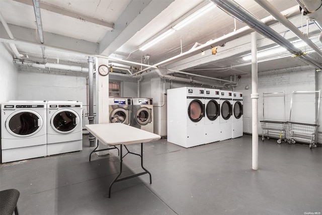 clothes washing area featuring independent washer and dryer