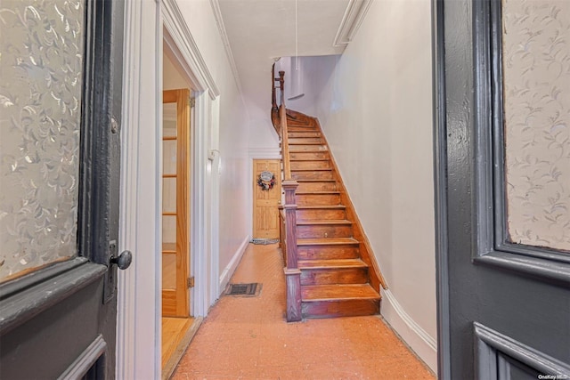 stairs featuring ornamental molding