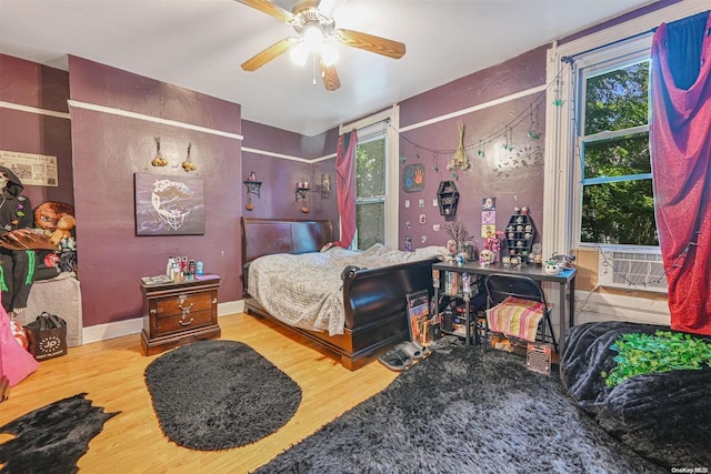 bedroom featuring ceiling fan and hardwood / wood-style floors