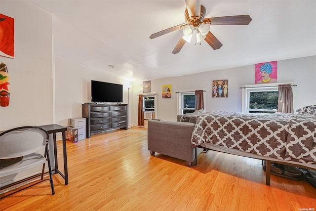 living room with ceiling fan and light wood-type flooring