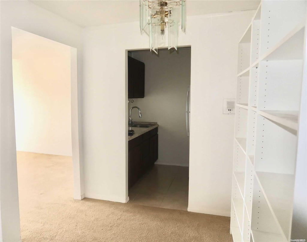 interior space with carpet flooring and sink