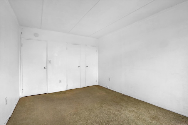 135 Post Ave Unit 6L, Westbury, NY 11590 - unfurnished bedroom featuring carpet floors