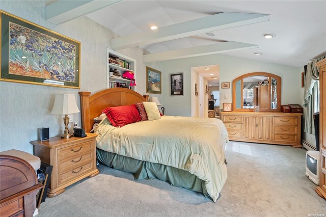 bedroom featuring lofted ceiling with beams and light carpet