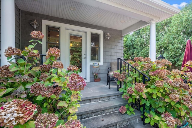 property entrance featuring a porch