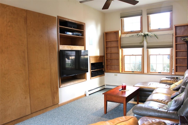 carpeted living room featuring a baseboard heating unit and ceiling fan