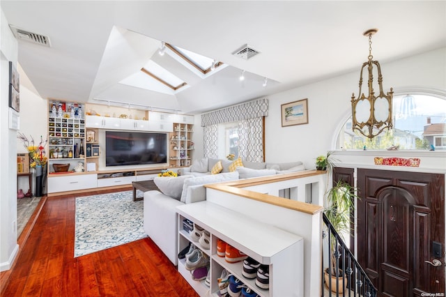3461 Ocean Ave, Oceanside, NY 11572 - living area with a skylight, dark wood-type flooring, and a chandelier