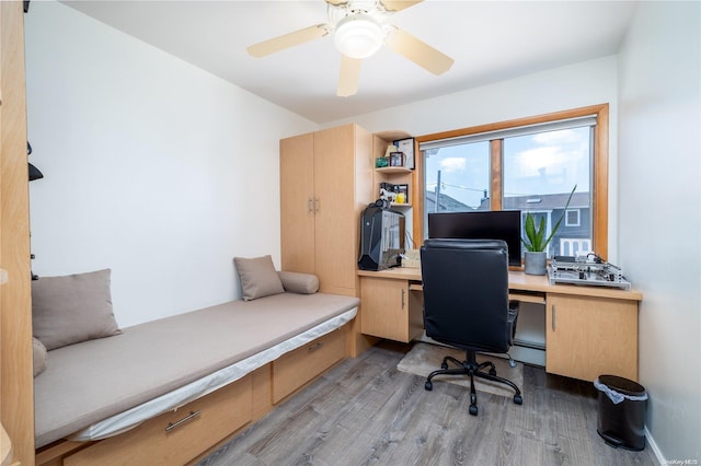 3461 Ocean Ave, Oceanside, NY 11572 - home office featuring light wood-type flooring, a ceiling fan, and baseboard heating