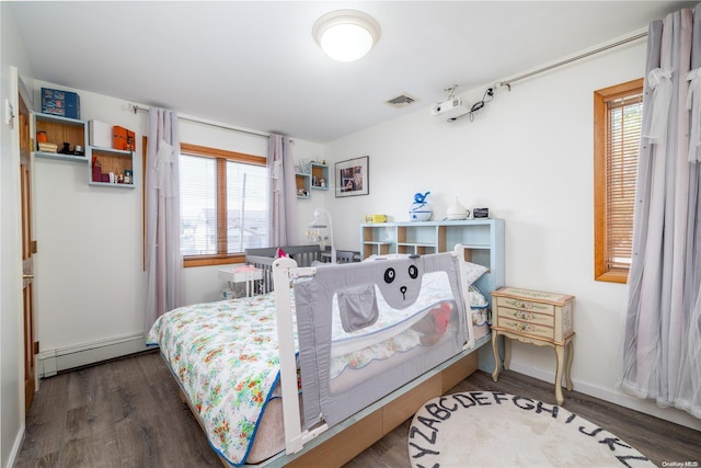 3461 Ocean Ave, Oceanside, NY 11572 - bedroom with a baseboard heating unit, multiple windows, and wood finished floors