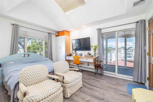 3461 Ocean Ave, Oceanside, NY 11572 - bedroom featuring baseboard heating, access to outside, vaulted ceiling, light wood-style floors, and recessed lighting