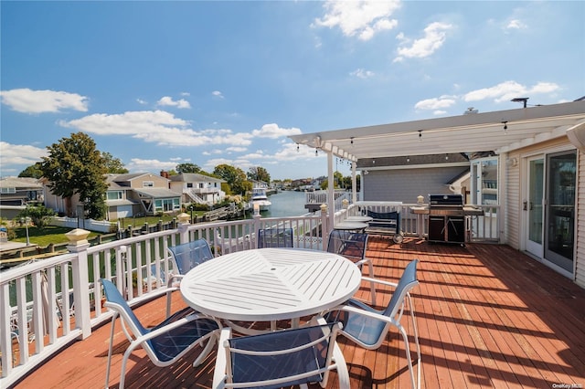 3461 Ocean Ave, Oceanside, NY 11572 - wooden terrace with outdoor dining area, area for grilling, and a water view