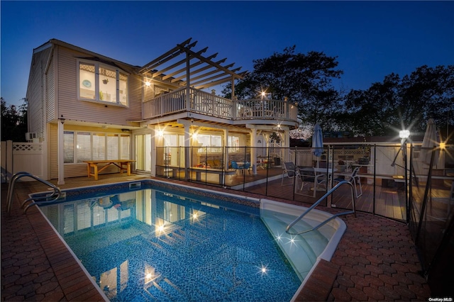 3461 Ocean Ave, Oceanside, NY 11572 - pool at night with a pergola and a patio