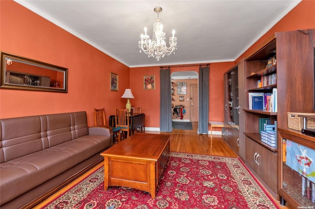 living room featuring a chandelier and light hardwood / wood-style floors