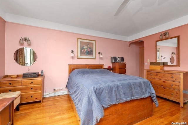 bedroom with ceiling fan and light hardwood / wood-style flooring