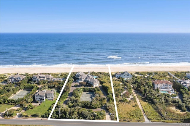 birds eye view of property featuring a water view and a view of the beach