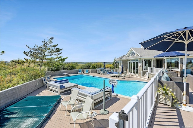 view of pool with a diving board