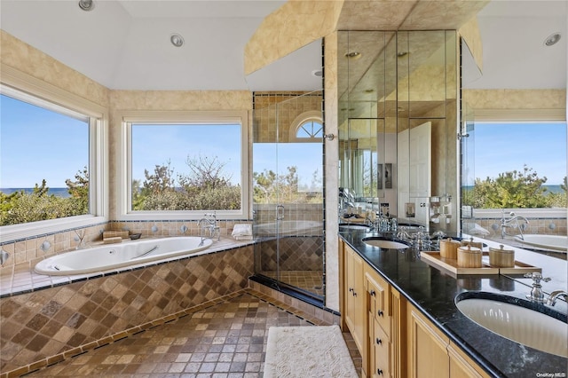 bathroom featuring tile patterned floors, vanity, and separate shower and tub