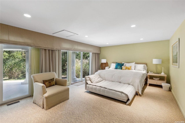 bedroom with access to exterior and light colored carpet