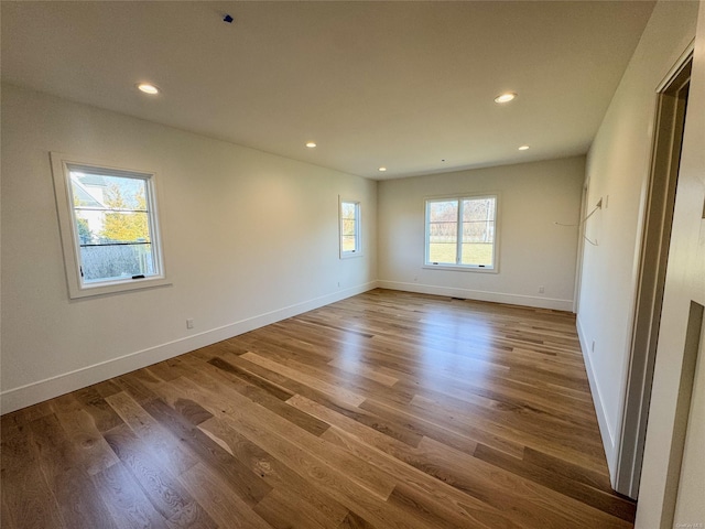 spare room with wood-type flooring