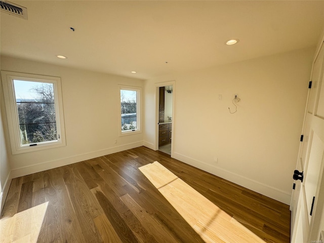 spare room featuring dark wood-type flooring