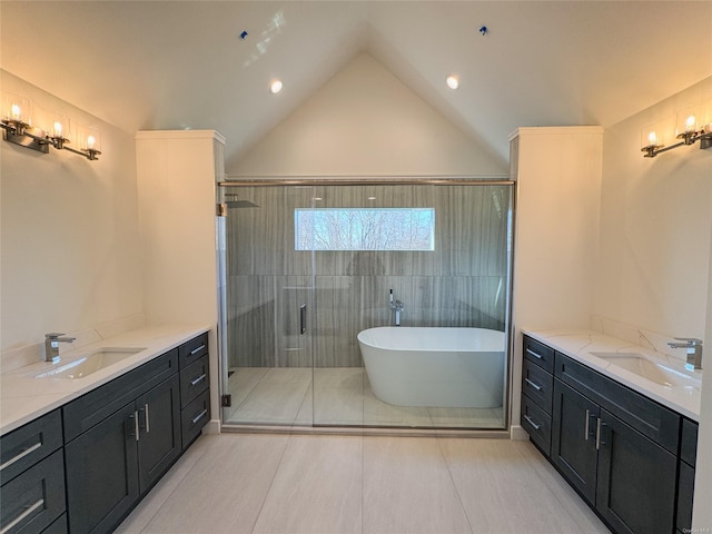 bathroom featuring vanity, lofted ceiling, independent shower and bath, and tile patterned flooring